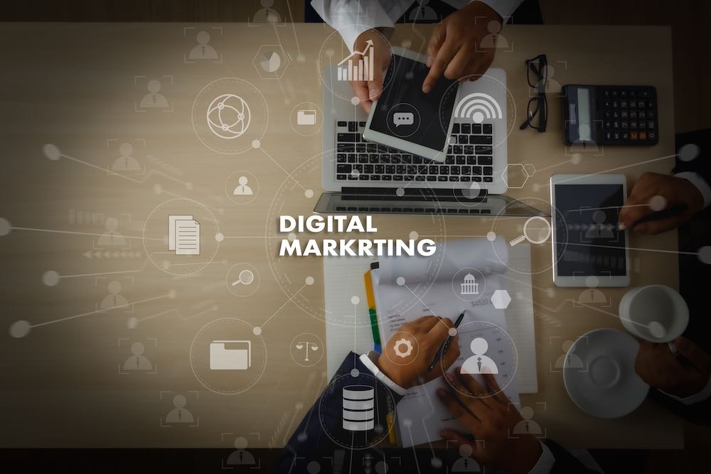 DIGITAL MARKETING new startup project MILLENNIALS Business team hands at work with financial reports and a laptop